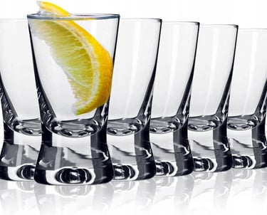 a glass of lemonade with a slice of lemonade on a white background