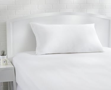 a bed with a white bedding and a white bed