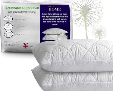 a bed with a pillow and pillows on it