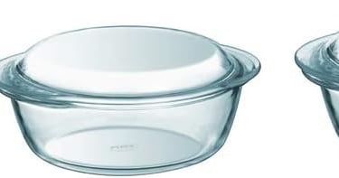 three glass containers with lids and lids on them