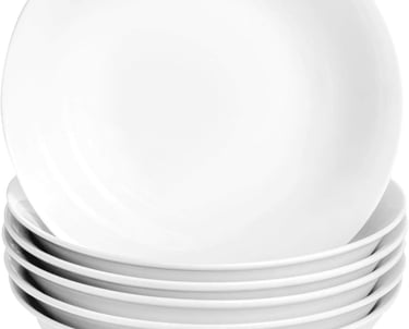 a stack of white plates with white plates and bowls