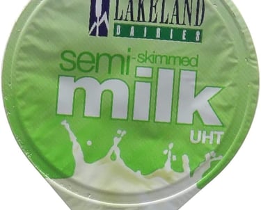 a container of milk with a green and white label