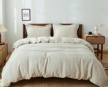 a bed with a white bed and a lamp