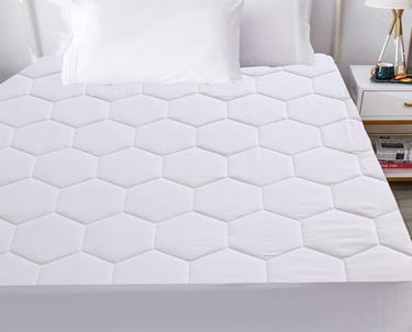 a bed with a white bed and a white bed