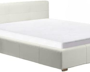 a bed with a white bed and a white bed