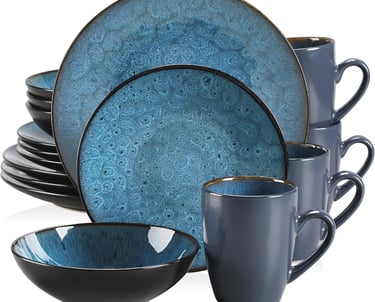 a blue dinner set with a cup of coffee and a mug