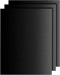 a set of three black and white cardstocked with a black background
