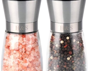 a couple of salt shakers with pink and white salt