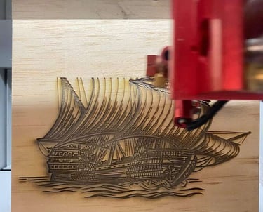 a machine that is cutting through a piece of wood
