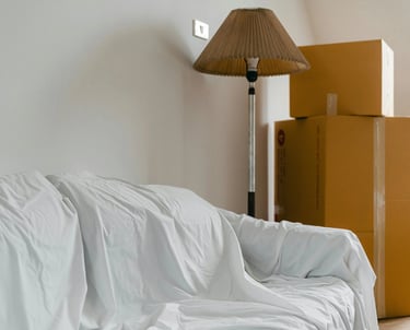 Professional move in and move out cleaning service with boxes in an empty home