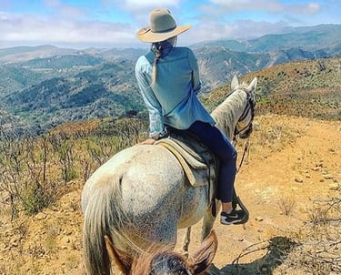 Woman riding a horse at Circle Bar B Santa Barbara