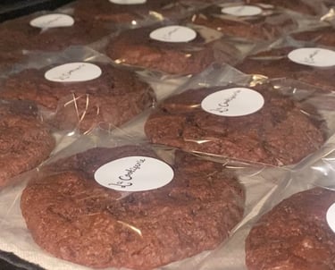 a tray of cookies with labels on them