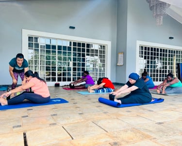 Posture correction with Yoga participants during the class
