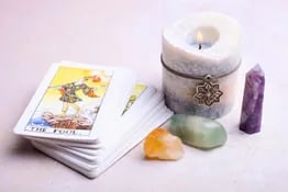 a candle with a candle and a candle on a table