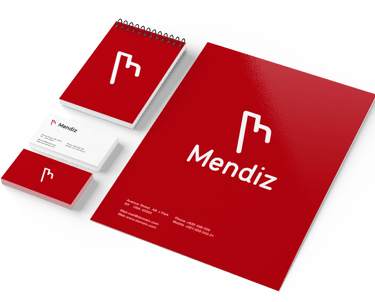Materiais de papelaria da Mendiz com identidade visual em vermelho e branco