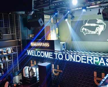 a bar with a large screen and a large screen