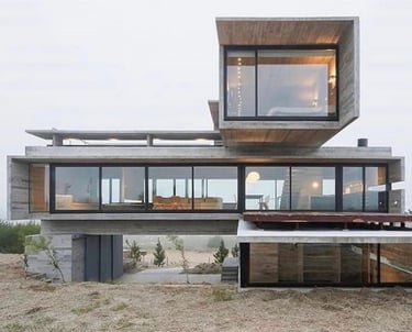 Livorohaus modern villa house with a large glass window and a view of the ocean