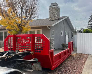 Our 5 ton lowboys are red in color and will take concrete, tile, rocks, and mix materials.