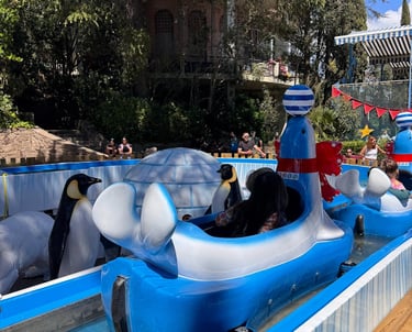 a group of penguins in a boat shaped like a boat at Tibidabo Barcelona