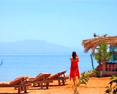 Single woman on the beach of Bedouin star