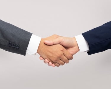 Saudi Food Registration Handshake or meeting between two business professionals