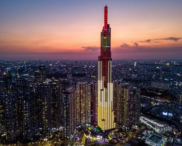Sunset over Saigon with Landmark 81, the tallest building in Vietnam, silhouetted against the sky.