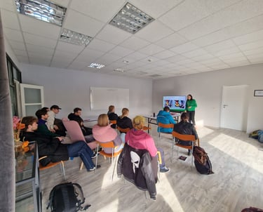 a group of people sitting in chairs in a room