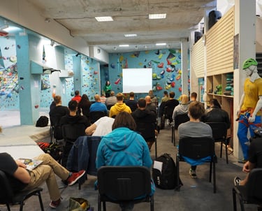 a group of people sitting in chairs in a room