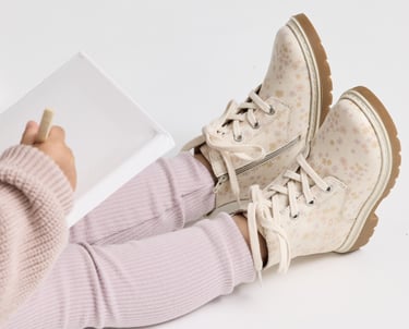 Fashion campaign photography - a child's feet in a pair of floral shoes