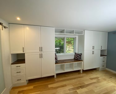 wall to wall cabinetry with window seat area