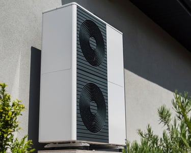 a white air conditioner sitting on a building
