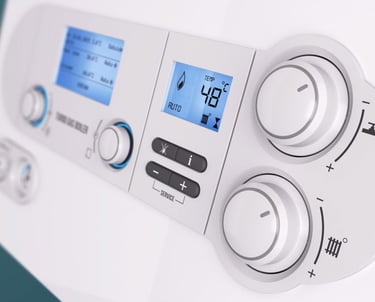 a white and blue control paneled in a white wall