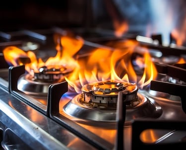 a stove top with flames on a stove top