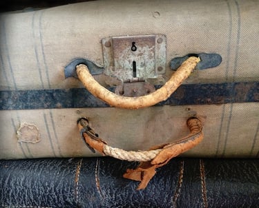 a suitcase with a smile on it