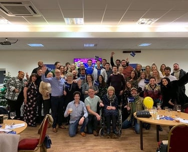 Image of a large group of Tim's friends and family at one of his quizzes.