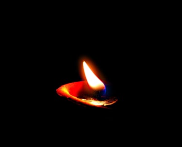 a candle lit up in the dark