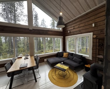 Modern log house, high ceiling, lapland log home, large scenic windows overlooking forest