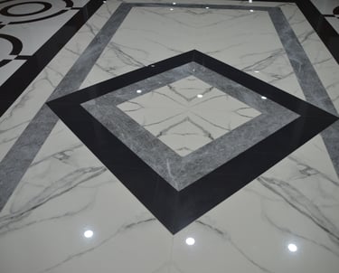a marbled floor with a square shaped mirror