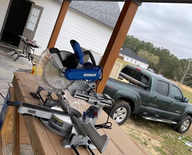 ofessional woodworking equipment set up for an outdoor carpentry project by Garnet Painting in Douglas, GA.