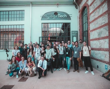 a group of people standing in front of a building