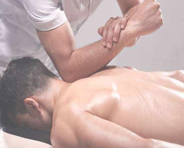 Firm pressure massage with the therapist using there elbow to get deep into the back muscle