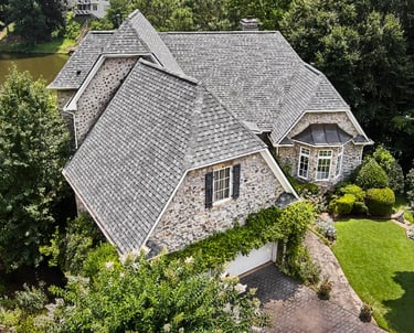 a house with a large roof and a large house with a large, stone -