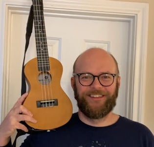 Blair Raker ukulele instructor posing with ukulele