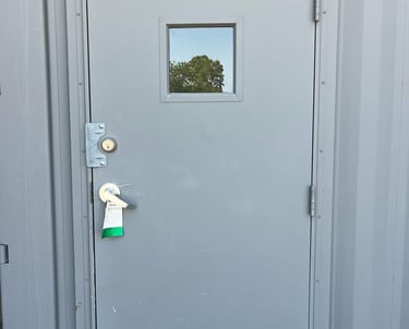 Pass through door on a grey container