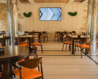 a restaurant with a large screen tv and a television