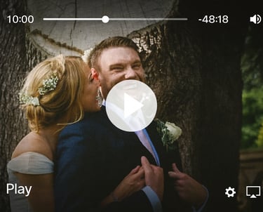 a man and woman kissing in a wedding video recorded in south wales