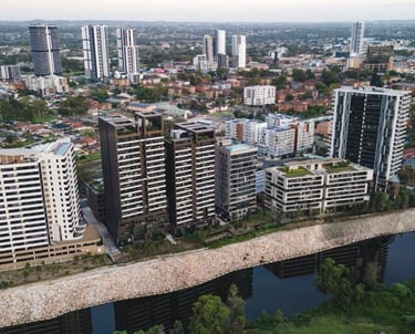 Aerial view of modern high-rise buildings and apartments along Georges River in Liverpool