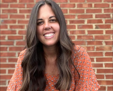 a woman with long hair and a smile on her face