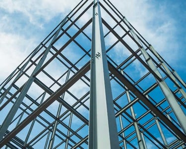 a tall metal structure with a sky background