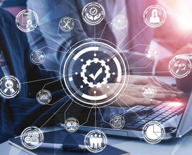 a woman in a business suit is holding a laptop and a clock on the table